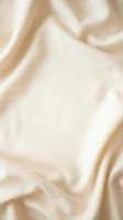 Soft beige silk fabric with elegant flowing folds and smooth texture for luxury fashion and interior design backgrounds.