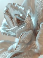 Ethereal silver metallic fabric with flowing ripples and folds creates abstract waves and textures in soft light, suitable for luxury fashion and design backgrounds.