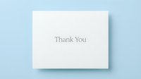 White thank you card with elegant serif text on a soft blue background, conveying gratitude and appreciation for events and celebrations.