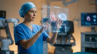 Female surgeon in blue scrubs and surgical cap interacting with futuristic holographic heart display in modern operating room for medical technology concepts.