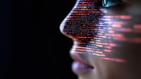 Digital code projection on female face profile in dark background with glowing red and blue data streams representing artificial intelligence and machine learning technology.