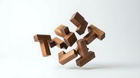 Wooden puzzle pieces floating in mid-air against white background, showcasing interlocking geometric shapes for brain training and problem solving games.