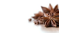 Star anise spices on wooden surface with copy space for culinary and cooking projects, natural brown aromatic seasoning ingredients for food design.