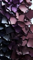 Crushed eyeshadow palette in shimmering purple and plum shades showing detailed texture and metallic fragments of broken makeup powder.