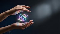 Female hands protecting glowing atomic symbol with electrons orbiting nucleus representing science education, physics research and nuclear energy concepts.