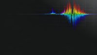 Colorful audio waveform visualization with rainbow spectrum frequencies on dark grid background for music production and sound engineering applications.