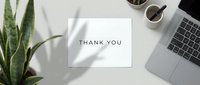 Minimalist thank you card on a clean white desk with laptop, plant, and coffee cup, flat lay top view for business or personal use.