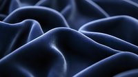 Smooth navy blue silk fabric with elegant folds and gentle curves creates dramatic light and shadow play, showcasing luxurious textile surface texture.