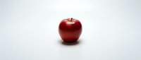 Fresh red apple isolated on white background for healthy eating and nutrition concepts.