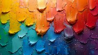 Vibrant rainbow color palette of thick paint swatches with water droplets creating textured surface, arranged in spectrum order from yellow through red to purple.