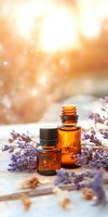 Essential oil amber bottles with fresh lavender sprigs on rustic wooden surface, soft golden sunlight and bokeh creating spa-like atmosphere for wellness products.