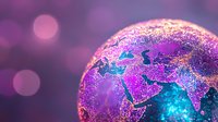 Glowing digital Earth globe with vibrant purple and turquoise colors showing continents and geographical borders against blurred bokeh background.