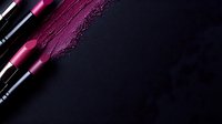 Pink lipstick smudge and smear texture on dark background with cosmetic product, makeup artistry concept for beauty and fashion industry.