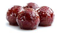 Fresh red plums with water droplets on white background, ripe juicy stone fruits for healthy eating and cooking recipes.