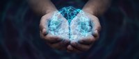 Hands holding glowing digital brain with neural network connections representing artificial intelligence, machine learning and futuristic technology concepts.