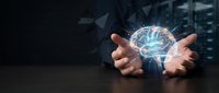 Businessman hands protecting glowing digital brain with neural networks in modern office environment representing artificial intelligence and innovation.