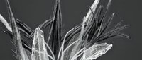 Abstract crystalline ice formations with sharp angular spikes and translucent structures against dark background for modern design projects.