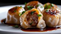 Pan-seared scallops with caramelized glaze and fresh herbs on white plate. Gourmet seafood dish for fine dining restaurant menus and culinary presentations.