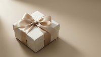 Elegant white gift box with a satin beige ribbon bow on a neutral beige background, perfect for holiday, wedding, or luxury gifting concepts.