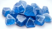Vibrant blue crystal gemstones with faceted surfaces arranged on white background, showcasing translucent properties and natural mineral formation.