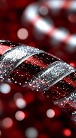 Festive red and silver striped candy cane macro with glitter and bokeh background, holiday decoration detail with sparkling texture and soft focus effect.