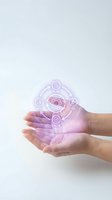 Hands holding glowing purple holographic workflow diagram with interconnected icons representing plan, edit, check, and process steps for business technology and digital innovation concepts.