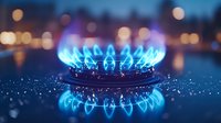 Blue gas stove burner flame glowing in dark kitchen with bokeh lights background, close up macro shot showing energy consumption and cooking concept.