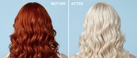 Hair transformation showing dramatic color change from vibrant red copper to platinum blonde with wavy styling on light blue background.
