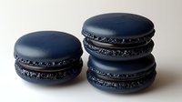 Dark blue macarons with sparkly filling isolated on white background. French pastry dessert cookies perfect for bakery menu, culinary design projects.