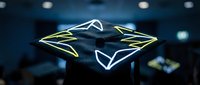 Futuristic holographic diamond-shaped interface with glowing neon edges floating in modern tech environment for digital design projects.