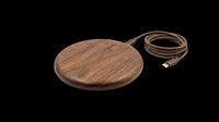 Wooden wireless charging pad with attached brown USB cable, isolated on transparent background. Ready for e-commerce, product mockups, tech accessories design, print-on-demand, and digital marketing materials.