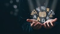 Hands holding glowing education icons including books, letters, and learning symbols on dark background. For educational content, e-learning platforms, training materials.