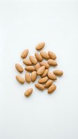 Scattered whole almonds isolated on white background, ready for food, nutrition, and healthy eating design projects.