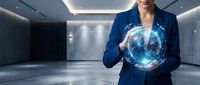 Professional businesswoman in blue suit holding glowing digital globe hologram in modern corporate office representing global technology and innovation.