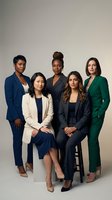 Group of five diverse women in professional business attire posing together against neutral background. Features women of various ethnicities wearing blazers and formal clothing for corporate, leadership, and team concepts.