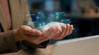 Businessman hands presenting holographic digital network interface with glowing data connections and futuristic technology elements in modern office.