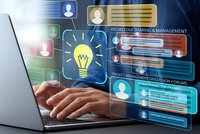 Professional working on laptop with digital innovation interface displaying lightbulb icon, project management tools and collaborative workspace elements.
