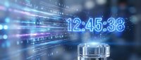 Digital clock display showing time 12:45:38 with glowing blue numbers and streaming data code in futuristic technology background for business presentations.