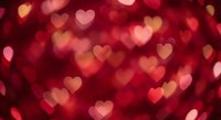 Romantic red heart bokeh lights background for Valentine's Day celebrations, love themes, wedding invitations and romantic design projects.