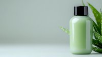 Minimalist green smoothie bottle with aloe vera leaves on light background, fresh healthy beverage concept for wellness and detox lifestyle.