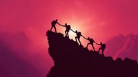 Silhouettes of climbers helping each other reach mountain summit against dramatic pink sunset sky, symbolizing teamwork and achievement.