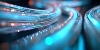 Glowing fiber optic cables with blue light streaks and bokeh effects create futuristic technology background for telecommunications and data transfer concepts.
