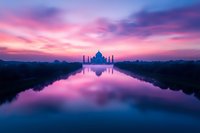 Majestic mausoleum silhouette reflected in calm water during dramatic purple and pink sunset with vibrant sky and clouds creating mirror effect in tranquil scene.