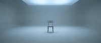 Single wooden chair positioned in empty minimalist room with neutral gray walls and bright ceiling light, suitable for conceptual design, interior styling, and contemporary art projects.