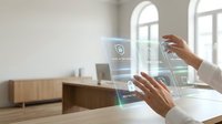 Young woman with medium skin tone using transparent digital interface display in modern office environment for business technology and augmented reality applications.