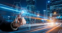 Businessman touching digital network interface with glowing icons over city traffic light trails at night representing connectivity and technology.