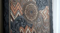 Ornate mandala and geometric patterns with swirls in copper, gray and white colors on decorative surface for luxury design projects and artistic backgrounds.