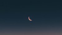 Crescent moon glowing with soft pink hues against dark blue night sky gradient background, minimalist celestial composition for astronomy and space designs.