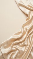 Luxurious champagne silk fabric with flowing waves and soft folds against neutral background, ideal for fashion, beauty, and luxury product design projects.