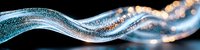 Glowing blue wave of particles with bokeh light effects on black background creates dynamic motion and energy flow visualization for technology designs.